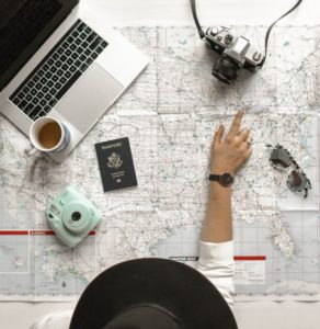 Woman pointing at a destination on a map