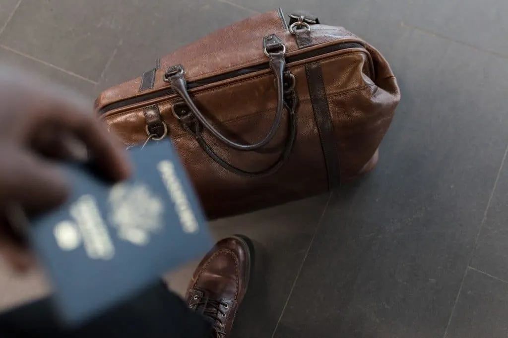 Man holding passport in airport