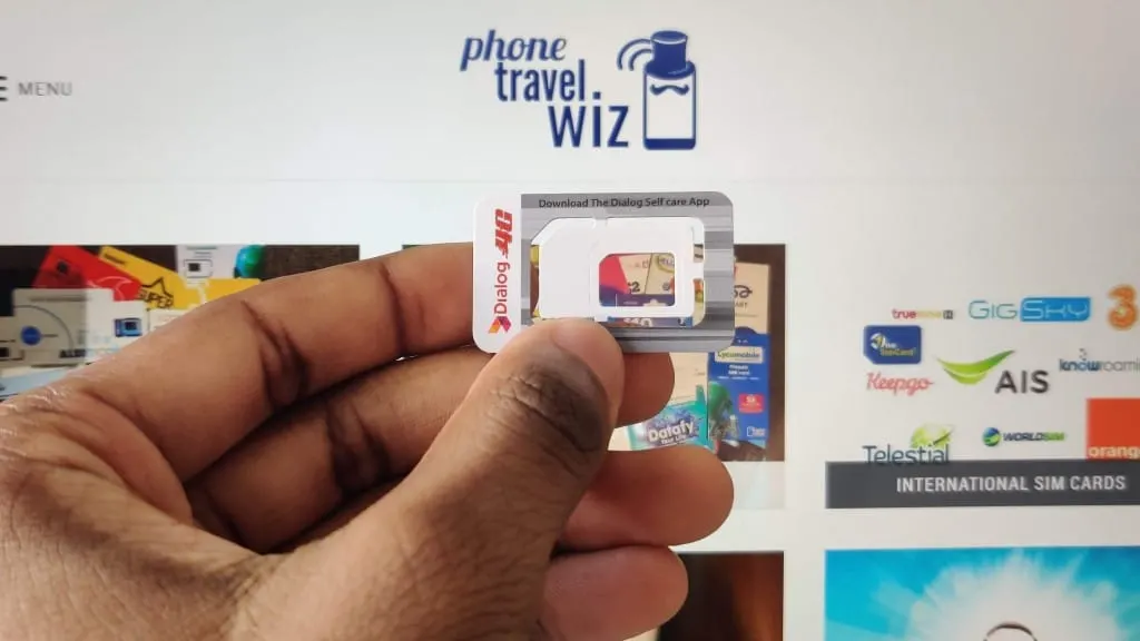 Adu from Phone Travel Wiz holding a Dialog SIM Card