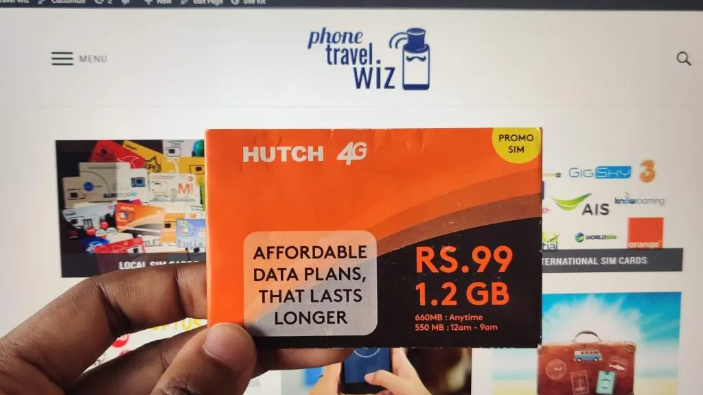 Adu from Phone Travel Wiz holding a Hutch SIM Card