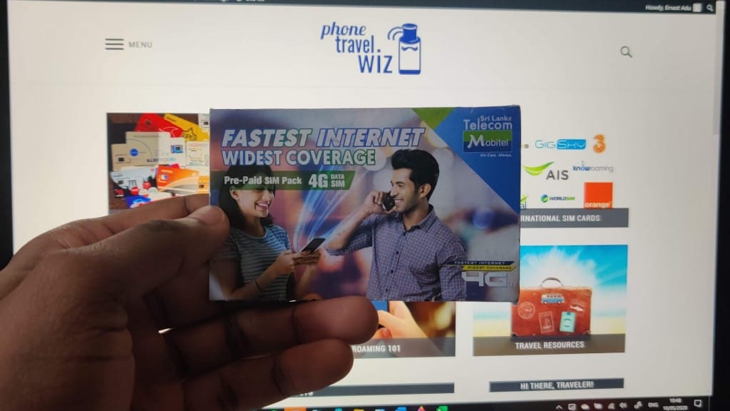 Adu from Phone Travel Wiz holding a Mobitel SIM card