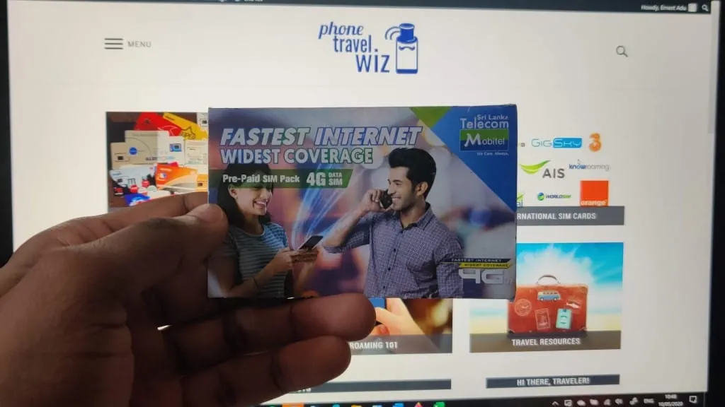 Adu from Phone Travel Wiz holding a Mobitel SIM card