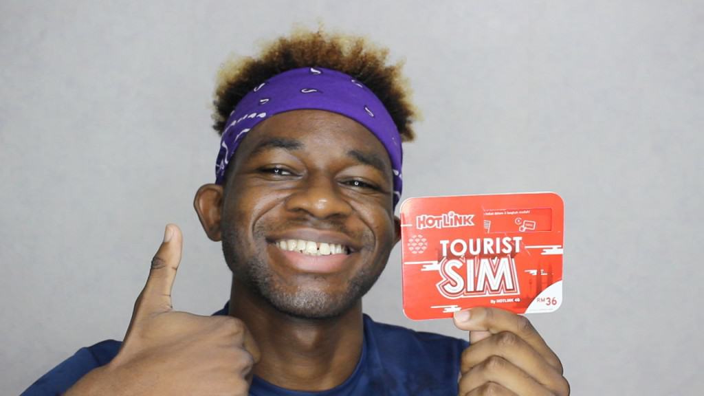 A happy Adu with his Hotlink SIM Card