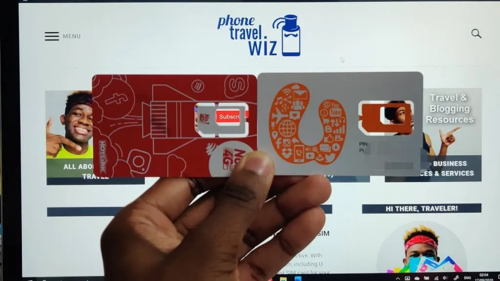 Adu from Phone Travel Wiz holding U Mobile and Hotlink SIM Cards
