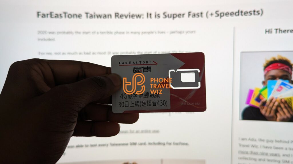 Far EasTone Telecom SIM Card Held by Adu
