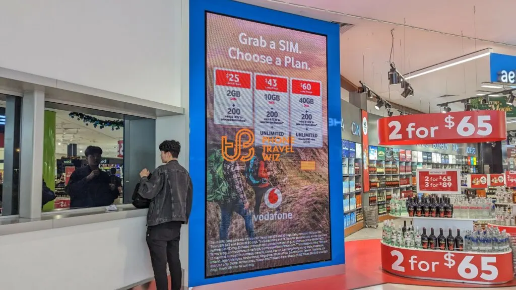 One-Vodafone New Zealand Travel SIM Plans Shown on a Screen in Auckland Airport