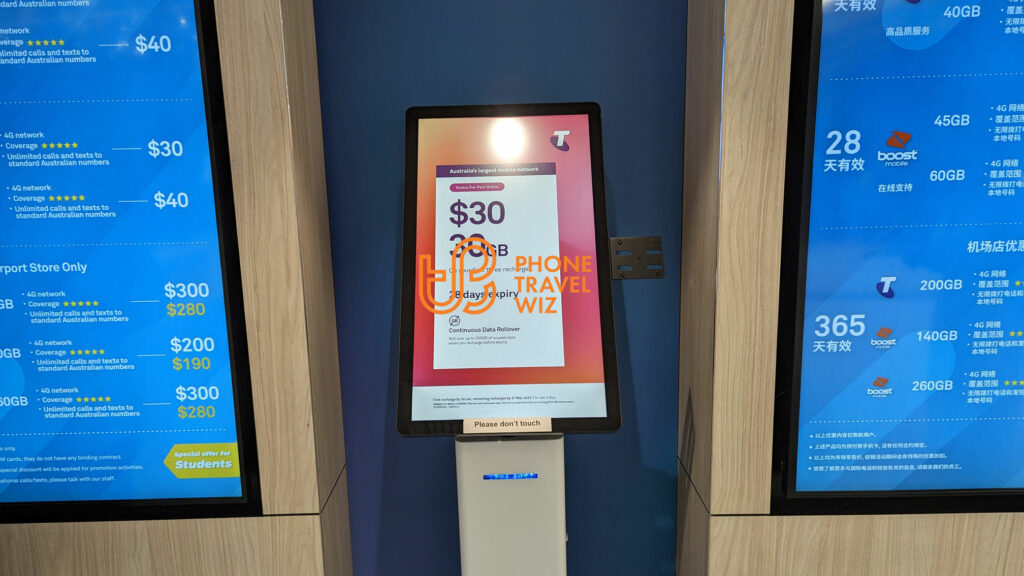 A Promotional Screen with Telstra SIM Cards at the Welcome Center at Melbourne-Tullamarine Airport