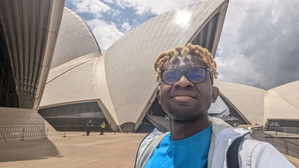 Adu from Phone Travel Wiz in front of the Sydney Opera House