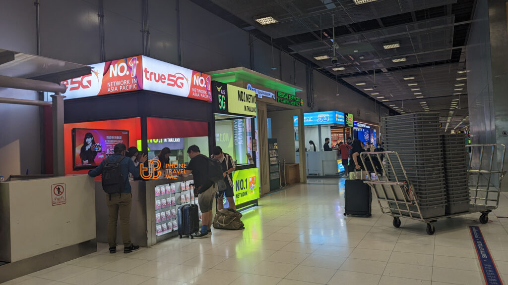 AIS, TrueMove H & Dtac Thailand Booths in the Arrivals Hall (Center) at Bangkok Suvarnabhumi Airport