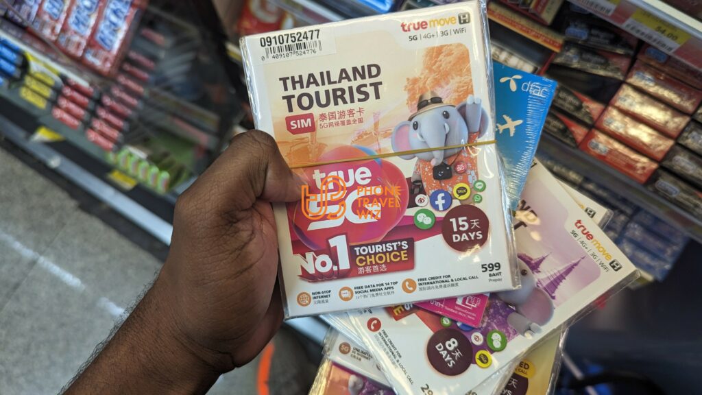 Adu from Phone Travel Wiz Holding TrueMove H Tourist SIM Cards at Bangkok-Don Mueang International Airport